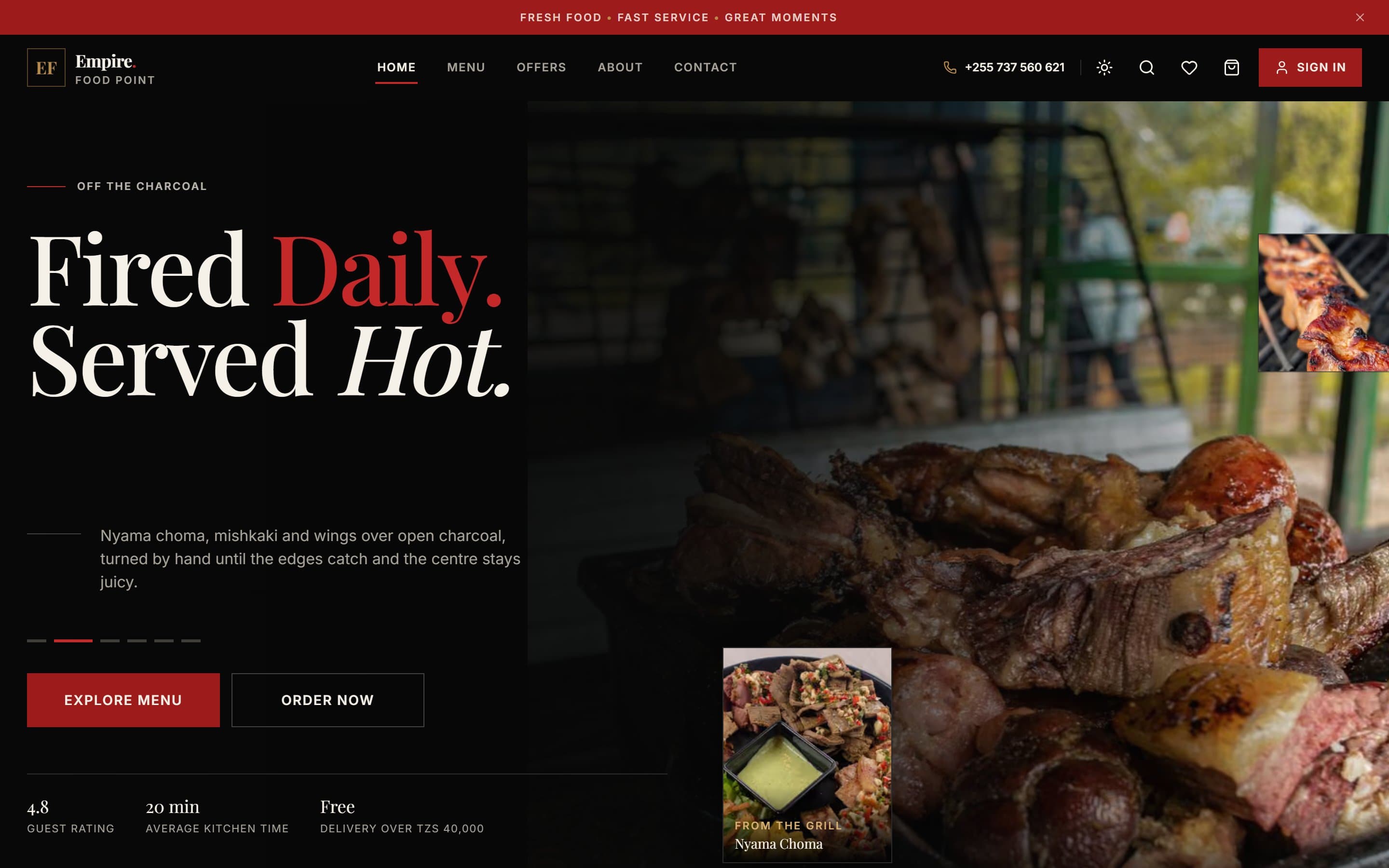 Empire Food Point home page on desktop in the dark theme: the “Fired Daily. Served Hot.” hero over charcoal-grilled meat, Explore menu and Order now buttons, guest rating, kitchen time and free-delivery threshold.