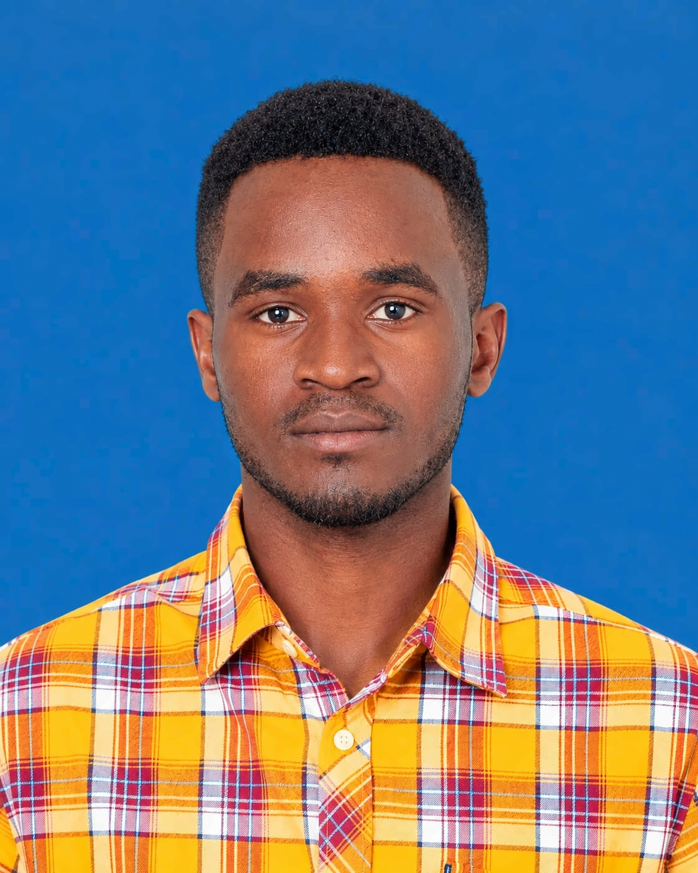 Passport photograph of Nicholaus Nungu Warobi facing the camera against a blue background.
